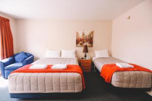 Postel nebo postele na pokoji v ubytování Addington Stadium Motel
