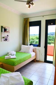 Ένα ή περισσότερα κρεβάτια σε δωμάτιο στο Belle Verte Villa Maleme +28 φωτογραφίες
