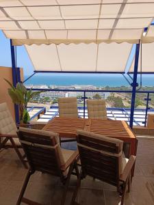 a patio with a table and chairs and a view at Panoramic Atalaya in Mojácar