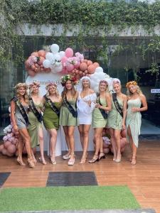 a group of women standing in front of a table with balloons at 20 off Special Brilliant Location in Seminyak +95 photos