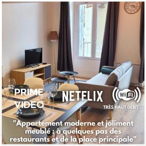 Televízia a/alebo spoločenská miestnosť v ubytovaní Appart’ entièrement rénové au centre ville St Étienne