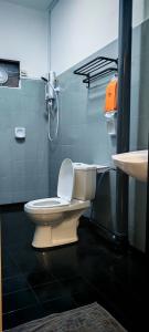 a bathroom with a toilet and a sink at 23 Inn Singlebed Share Bathroom No Window in Bukit Mertajam