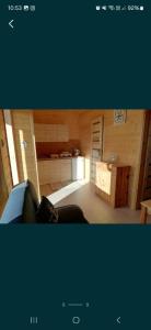 a view of a living room with a kitchen at Domki Cichy Zakątek in Darłowo +2 photos