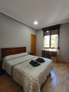 Postel nebo postele na pokoji v ubytování Hostal Abastos + 37 fotografií