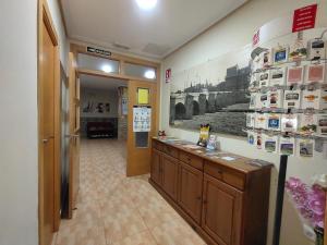 Kuchyň nebo kuchyňský kout v ubytování Hostal Abastos