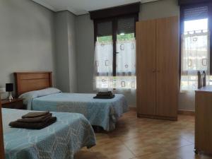 Postel nebo postele na pokoji v ubytování Hostal Abastos