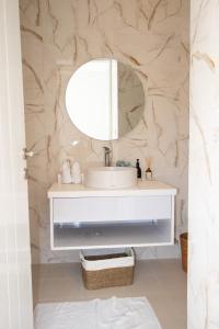 a bathroom with a sink and a mirror at Letto 2 - Amazing Cozy and Unique 2BDR Villa in Canggu with Private Pool in Canggu