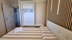 a small bathroom with a walk in shower and a rug at Casa Angy in Adrara San Rocco +21 photos