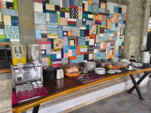 a table with food on it with a wall of tiles at Hotel Sari Bunga in Legian