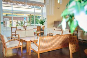a dining room with chairs and a table and a window at BRISTOL Hotel Opatija in Opatija