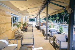 a row of chairs and tables on a patio at BRISTOL Hotel Opatija in Opatija
