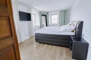 Ein Bett oder Betten in einem Zimmer der Unterkunft Gasthof zur Post Saulgrub