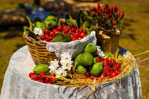 a basket of fruits and vegetables on a table at Pietrablu Resort & Spa - CDSHotels in Polignano a Mare