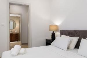 Ένα ή περισσότερα κρεβάτια σε δωμάτιο στο Modern 1BR Spacious Apartment with Terrace - Close to St Thomas Bay