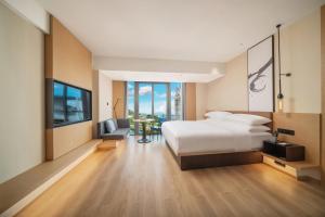 Postel nebo postele na pokoji v ubytování Fairfield by Marriott Shenzhen Dameisha