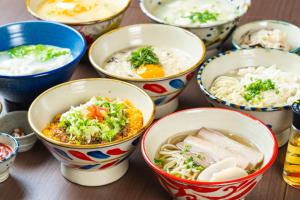 a group of bowls of food on a table at NAHA-WEST INN in Naha