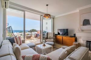 a living room with a couch and a fireplace at Luxury Sea View in Cascais