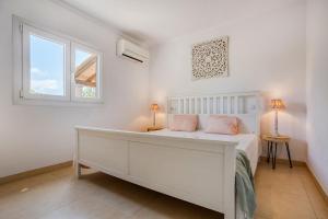 Posteľ alebo postele v izbe v ubytovaní Villa Escaletas