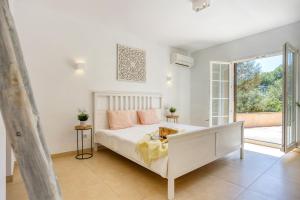 Posteľ alebo postele v izbe v ubytovaní Villa Escaletas