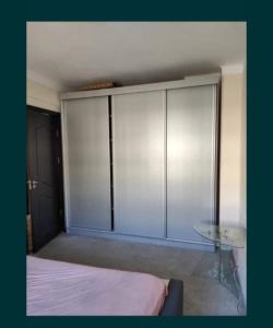 Un pat sau paturi într-o cameră la Apartament Central 2