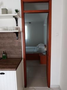 a small bathroom with a toilet in a room at Apartmani More Komarna in Komarna +56 photos