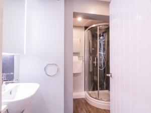 a bathroom with a sink and a shower at Number 1 in Sudbury +19 photos