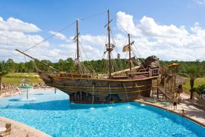 a pirate ship in a pool at a resort at Lake Buena Vista Resort Village and Spa, Near Disney in Orlando