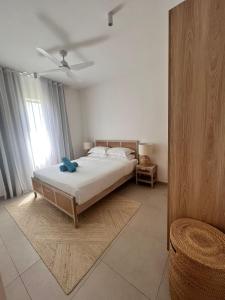 Postel nebo postele na pokoji v ubytování Beachfront Apartment Ocean Point