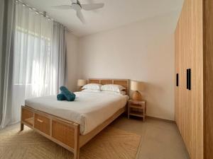 Postel nebo postele na pokoji v ubytování Beachfront Apartment Ocean Point