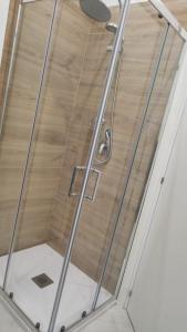 a shower with a glass door in a room at Appartamento Bella Vista in Adrano +20 photos