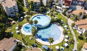an overhead view of a pool at a resort at HG Jardín de Menorca in Son Bou