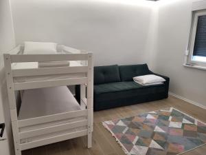 a living room with a bunk bed and a couch at Herzegovina Dream Residence in Stolac +11 photos
