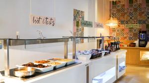 a buffet line with various food items on it at Comitas Tramontana Park in Fornells