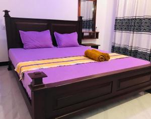 Voodi või voodid majutusasutuse Kurumba Lodge toas