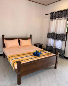 Voodi või voodid majutusasutuse Kurumba Lodge toas