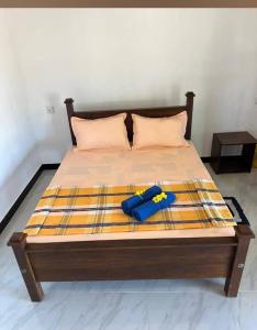 Voodi või voodid majutusasutuse Kurumba Lodge toas