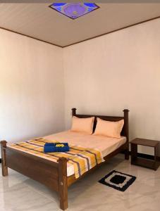 Voodi või voodid majutusasutuse Kurumba Lodge toas