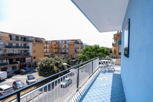 a balcony with a view of a parking lot at Prestige House 8 in Scalea