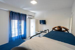 a hospital room with a bed and a window at Prestige House 8 in Scalea