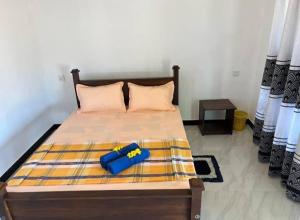 Voodi või voodid majutusasutuse Kurumba Lodge toas