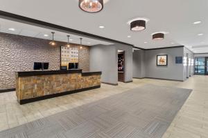a lobby with a reception desk in a building at Hampton Inn & Suites Columbus Scioto Downs in Columbus