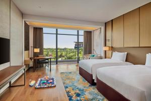 Voodi või voodid majutusasutuse Hilton Shanghai Fengxian toas