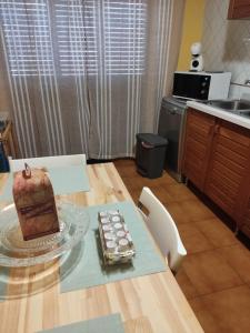 a cake sitting on a table in a kitchen at Nucifora's House in Riposto +9 photos