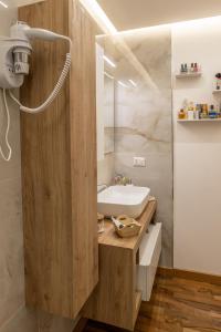 a bathroom with a white sink and a mirror at Villa aperta campagna in Nicosia +36 photos