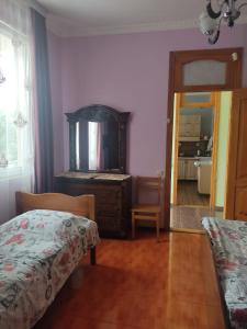 Letto o letti in una camera di Гостевой дом при кафе оазис