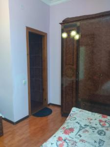 Letto o letti in una camera di Гостевой дом при кафе оазис