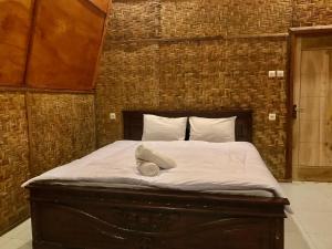 Postel nebo postele na pokoji v ubytování Bello Ethnic Bungalow & Resto