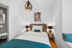 Letto o letti in una camera di GLANDON Rooms Haldenhof - Self-Check-In