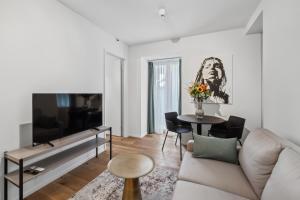TV o dispositivi per l'intrattenimento presso GLANDON Rooms Haldenhof - Self-Check-In