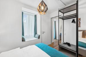 Letto o letti in una camera di GLANDON Rooms Haldenhof - Self-Check-In